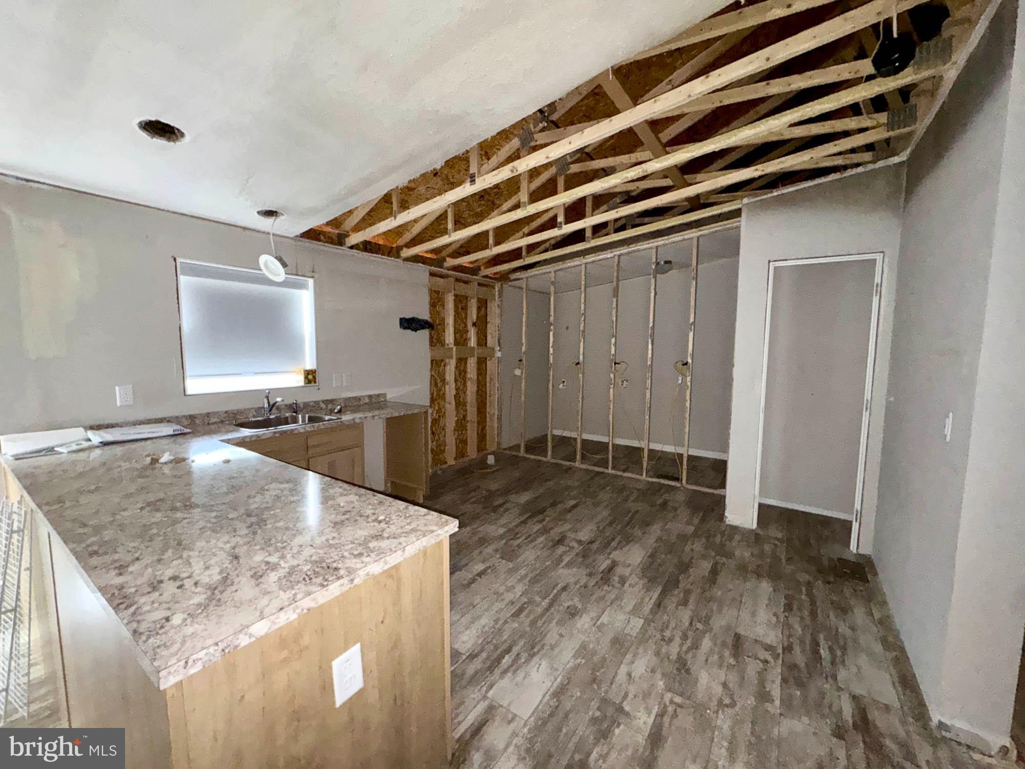 38 Groff Farm Road Conowingo, MD 21918 - Photo 5 of 30 a bathroom with a granite countertop sink and washing machine
