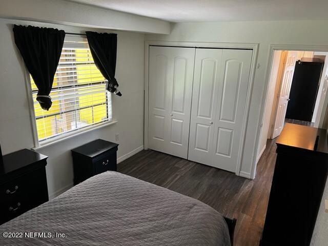 7222 Tropical Drive Weeki Wachee, FL 34607 - Photo 12 of 26 a bedroom with a bed and window