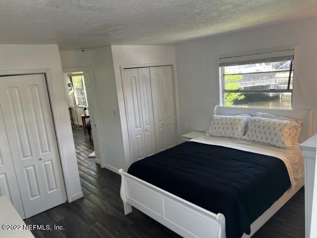 7222 Tropical Drive Weeki Wachee, FL 34607 - Photo 16 of 26 a bedroom with a bed and a window