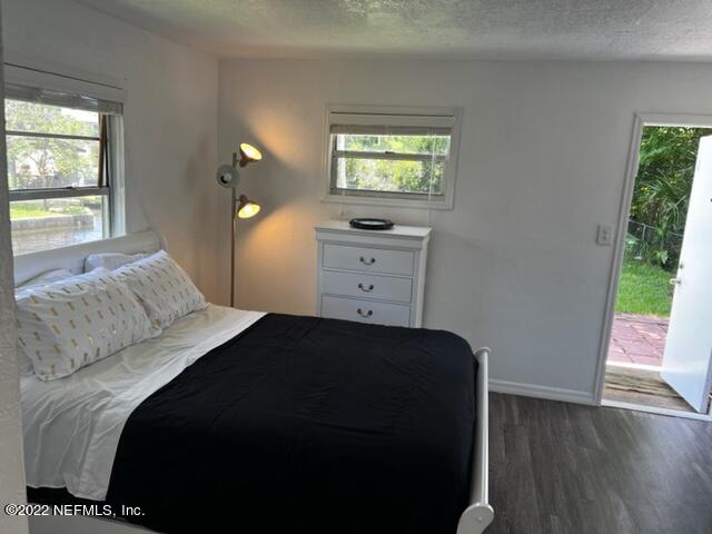 7222 Tropical Drive Weeki Wachee, FL 34607 - Photo 17 of 26 a bedroom with a bed and a window