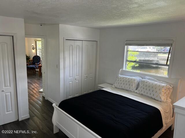 7222 Tropical Drive Weeki Wachee, FL 34607 - Photo 19 of 26 a bedroom with a bed and a window