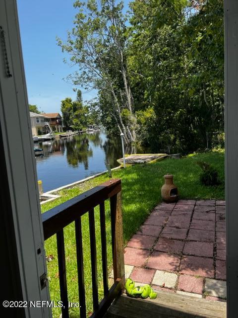 7222 Tropical Drive Weeki Wachee, FL 34607 - Photo 24 of 26 a view of a porch with a yard