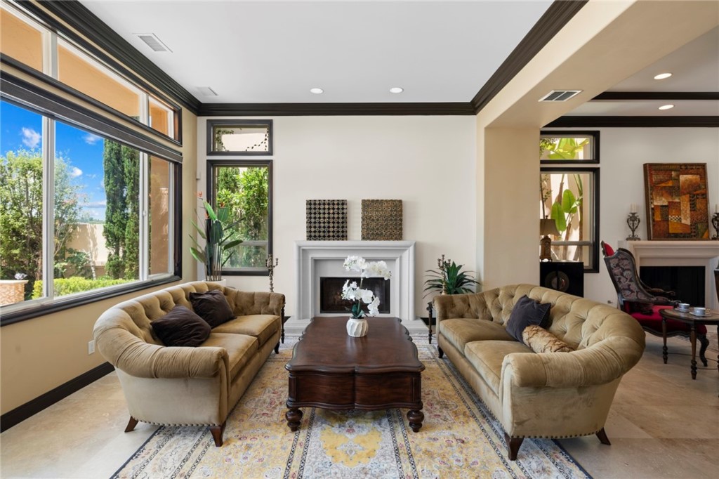 35 Silver Pine Drive Newport Coast, CA 92657 - Photo 11 of 31 a living room with furniture a fireplace and a large window