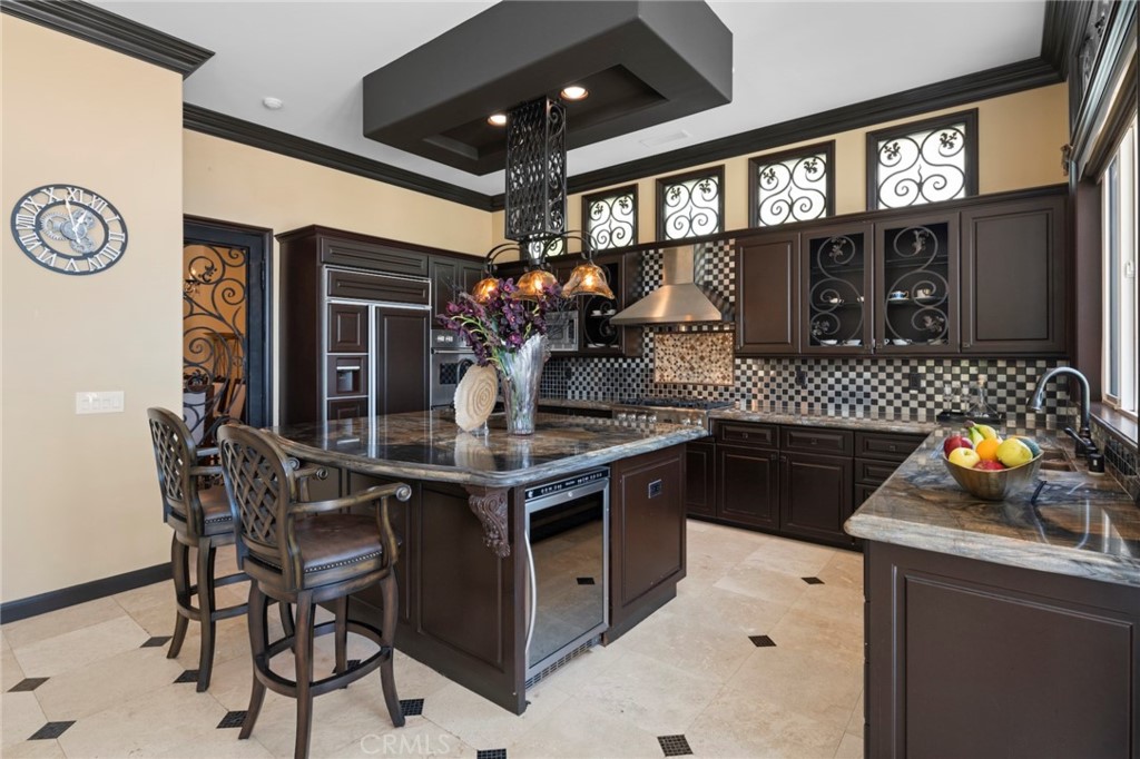 35 Silver Pine Drive Newport Coast, CA 92657 - Photo 14 of 31 a kitchen with stainless steel appliances granite countertop a stove a sink and a microwave