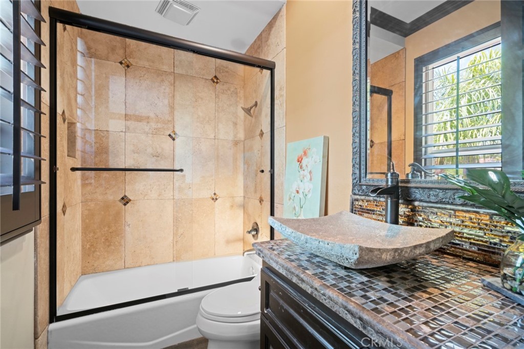 35 Silver Pine Drive Newport Coast, CA 92657 - Photo 27 of 31 a bathroom with a granite countertop sink a toilet and shower
