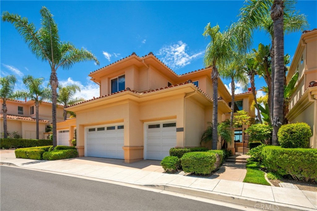 35 Silver Pine Drive Newport Coast, CA 92657 - Photo 3 of 31 a front view of a house with a yard and garage