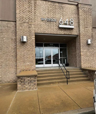 a view of building with parking area