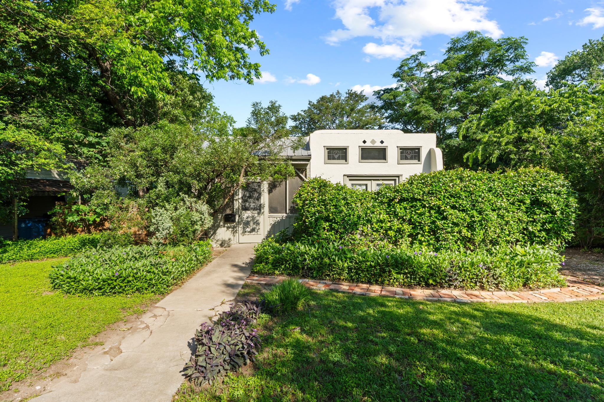4802 Rowena Avenue Austin, TX 78751 - Photo 1 of 37 A lush natural setting frames this unique Hyde Park gem.