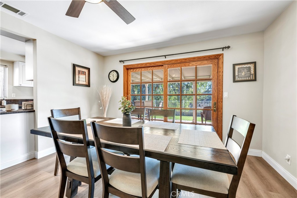 475 Termino Avenue Corona, CA 92879 - Photo 11 of 35 a view of a dining room with furniture window and wooden floor