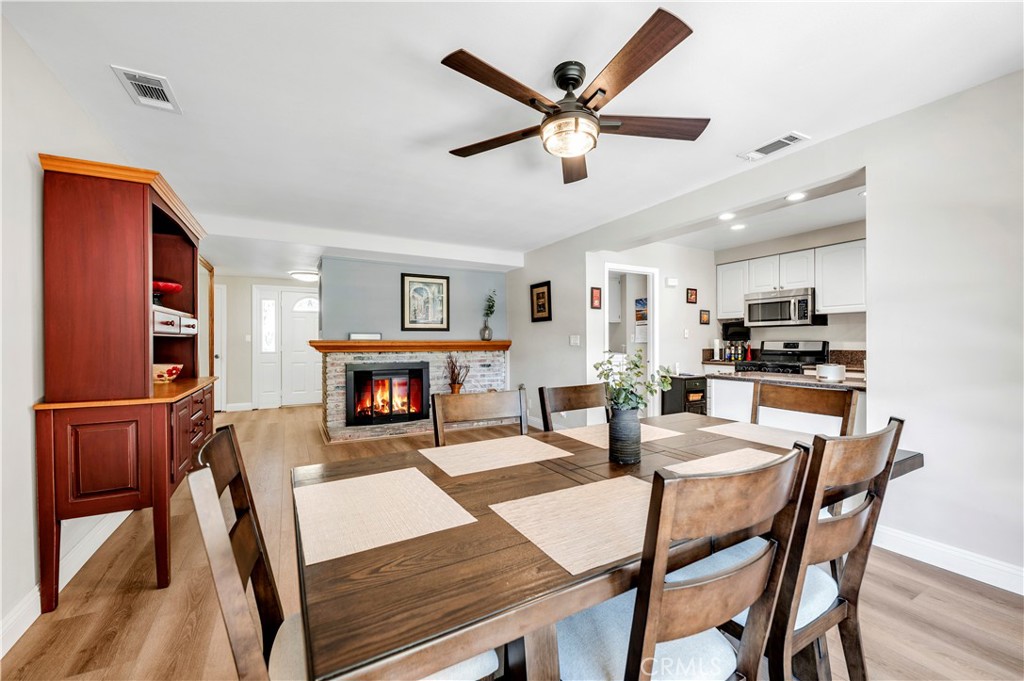 475 Termino Avenue Corona, CA 92879 - Photo 12 of 35 a view of a dining room with furniture and wooden floor