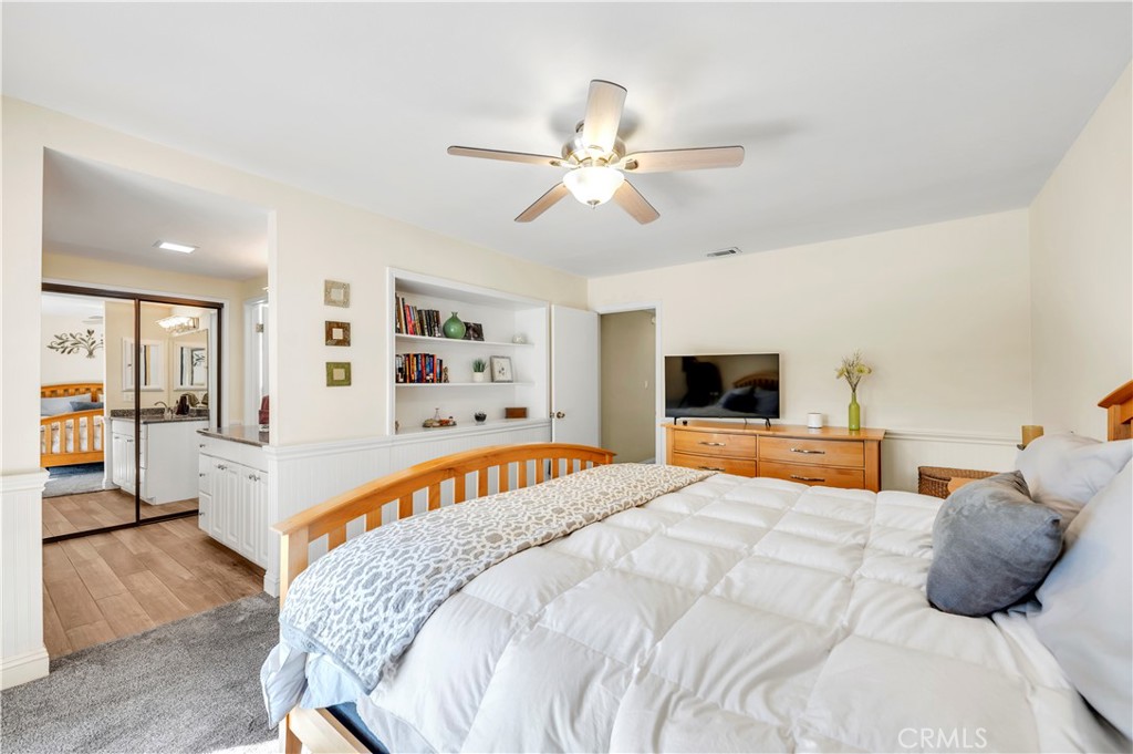 475 Termino Avenue Corona, CA 92879 - Photo 18 of 35 a bedroom with a large bed and a tv