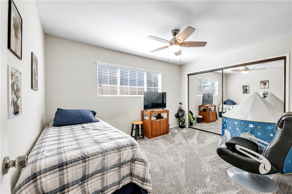 475 Termino Avenue Corona, CA 92879 - Photo 22 of 35 a bedroom with a bed and a couch