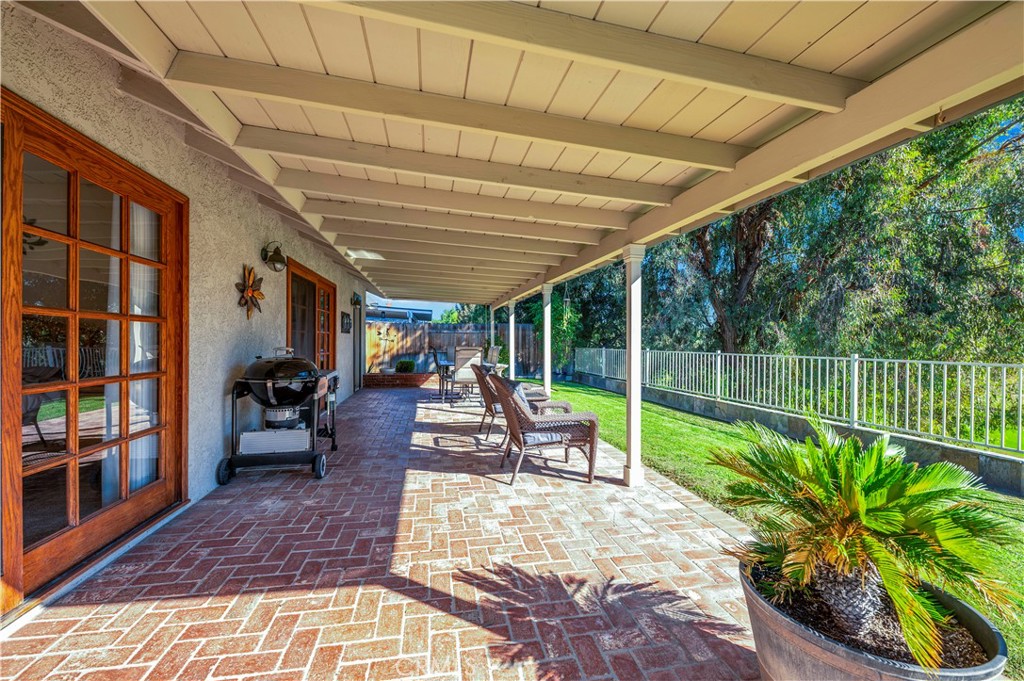 475 Termino Avenue Corona, CA 92879 - Photo 30 of 35 a view of a house with backyard sitting area and garden