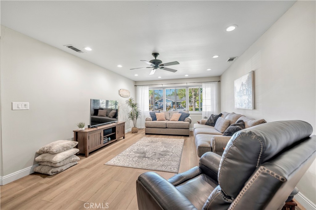 475 Termino Avenue Corona, CA 92879 - Photo 8 of 35 a living room with furniture and a flat screen tv