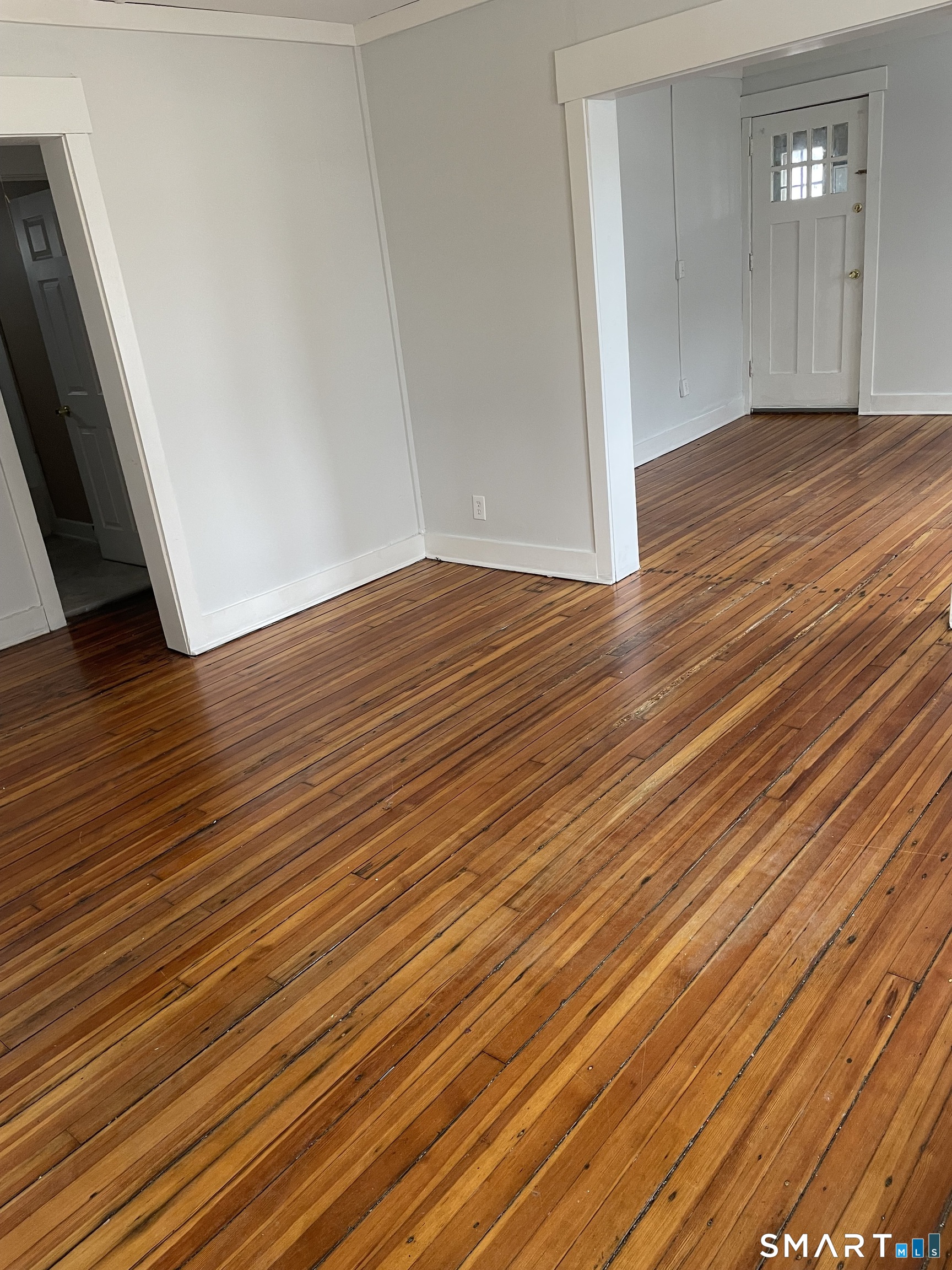 184 Meriden Road Waterbury, CT 06705 - Photo 2 of 14 wooden floor in an empty room