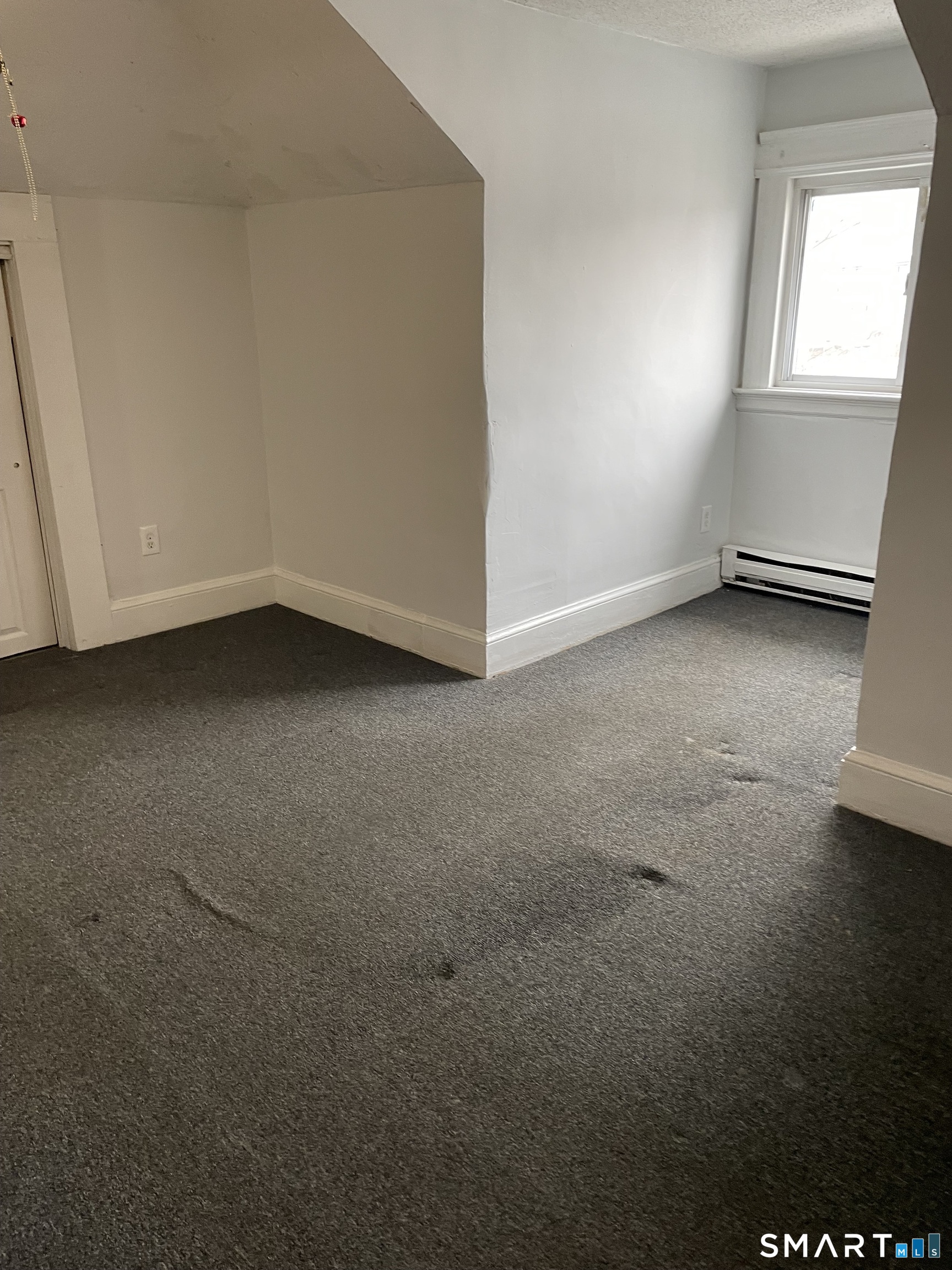 184 Meriden Road Waterbury, CT 06705 - Photo 10 of 14 a view of an empty room and window