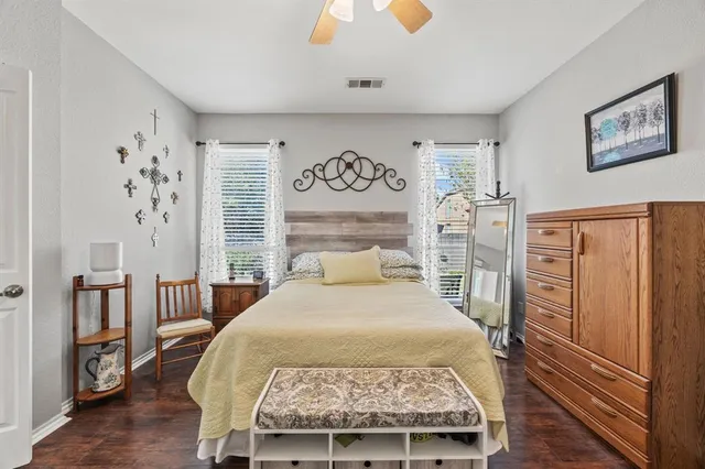 a bed sitting in a bedroom next to a window