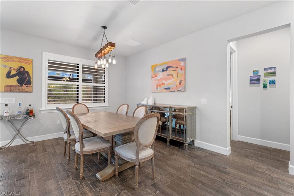 14240 Moonlit Way Estero, FL 33928 - Photo 11 of 50 a view of a dining room with furniture window and wooden floor