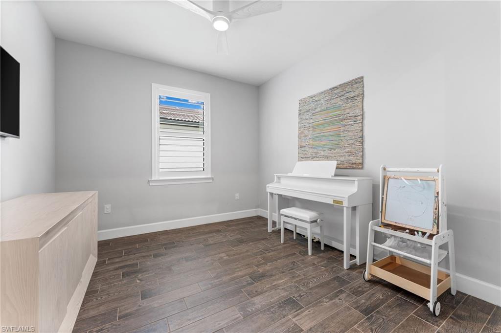 14240 Moonlit Way Estero, FL 33928 - Photo 17 of 50 a room with a desk and chair