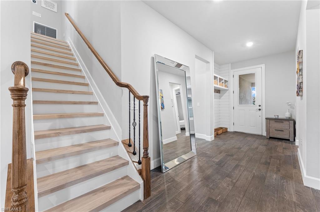 14240 Moonlit Way Estero, FL 33928 - Photo 19 of 50 a view of a livingroom with wooden floor and stairs