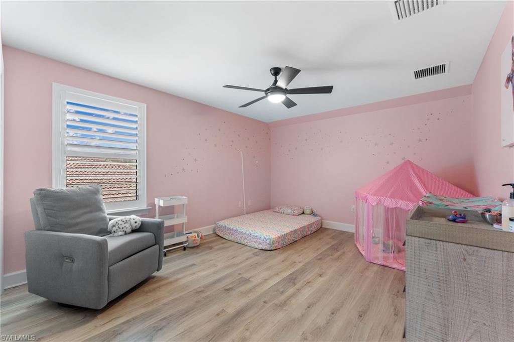 14240 Moonlit Way Estero, FL 33928 - Photo 22 of 50 a bedroom with furniture and a window