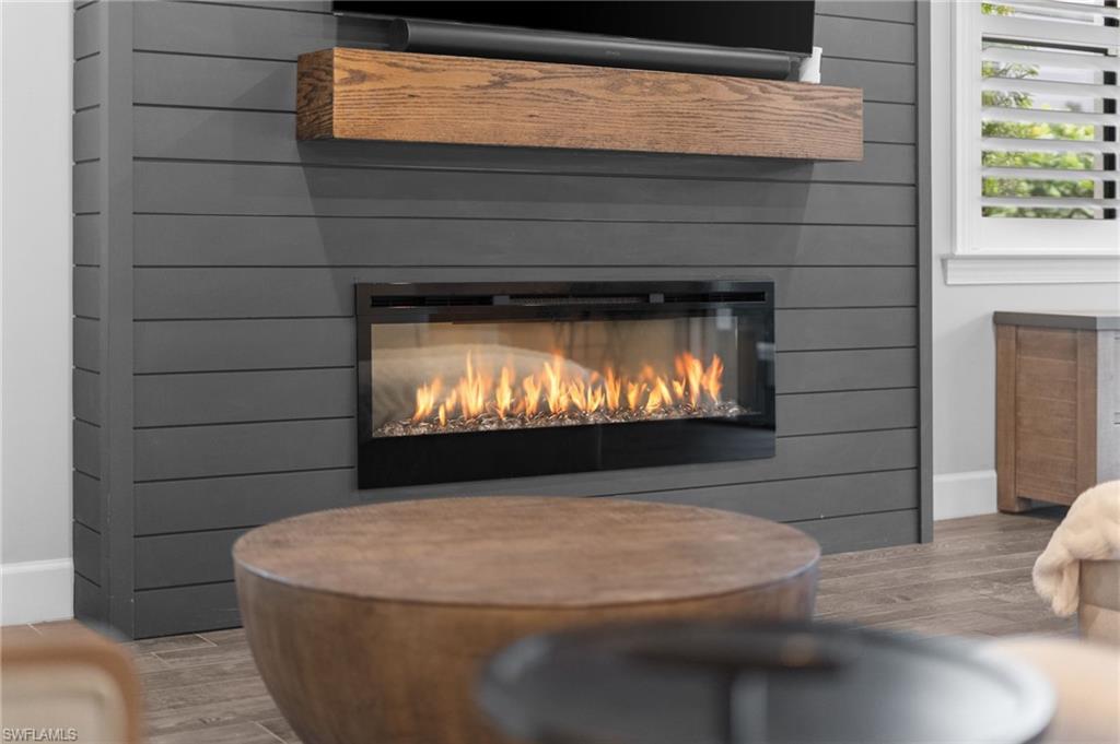 14240 Moonlit Way Estero, FL 33928 - Photo 3 of 50 a living room with a fireplace