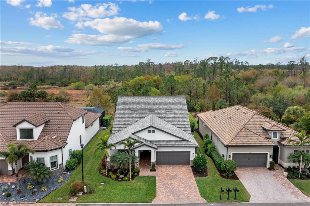 14240 Moonlit Way Estero, FL 33928 - Photo 38 of 50 an aerial view of a house with a garden