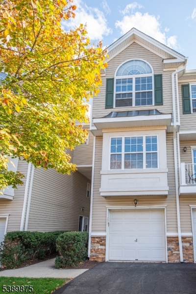 front view of brick house with a yard