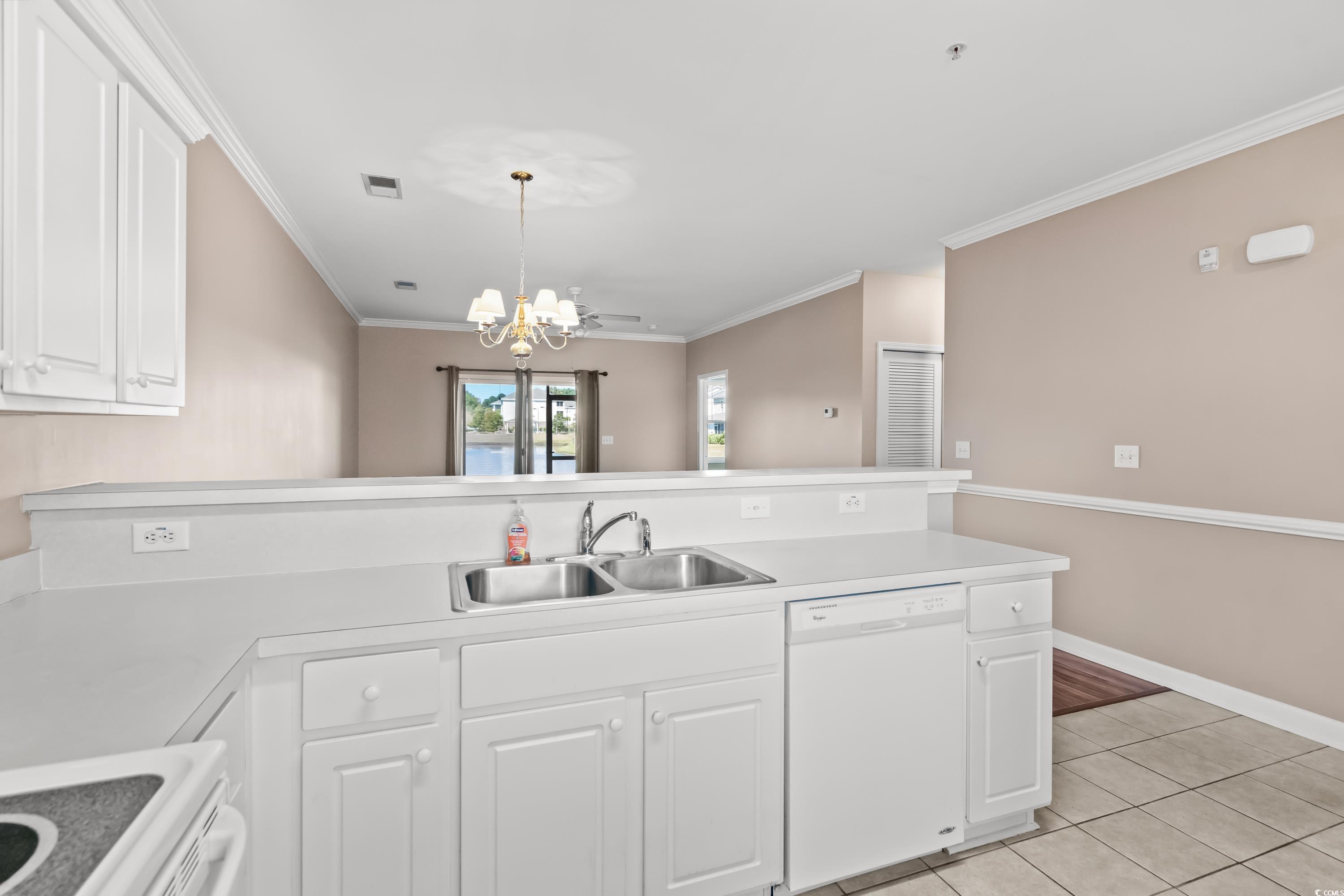 336 Kiskadee Loop, Unit B Conway, SC 29526 - Photo 18 of 40 Kitchen with a notable chandelier, white dishwasher, sink, and white cabinets