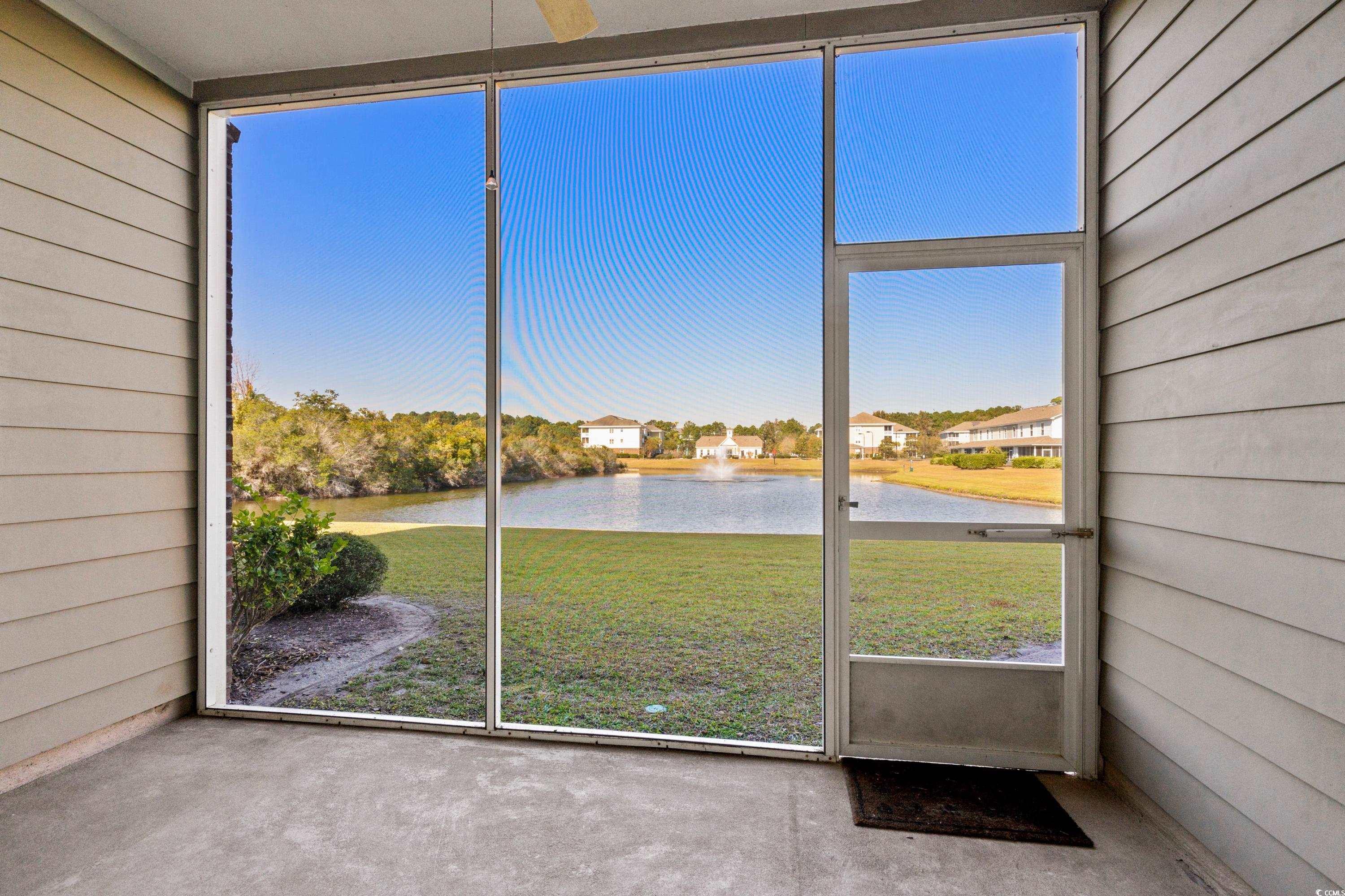 336 Kiskadee Loop, Unit B Conway, SC 29526 - Photo 19 of 40 Unfurnished sunroom with a water view and ceiling fan