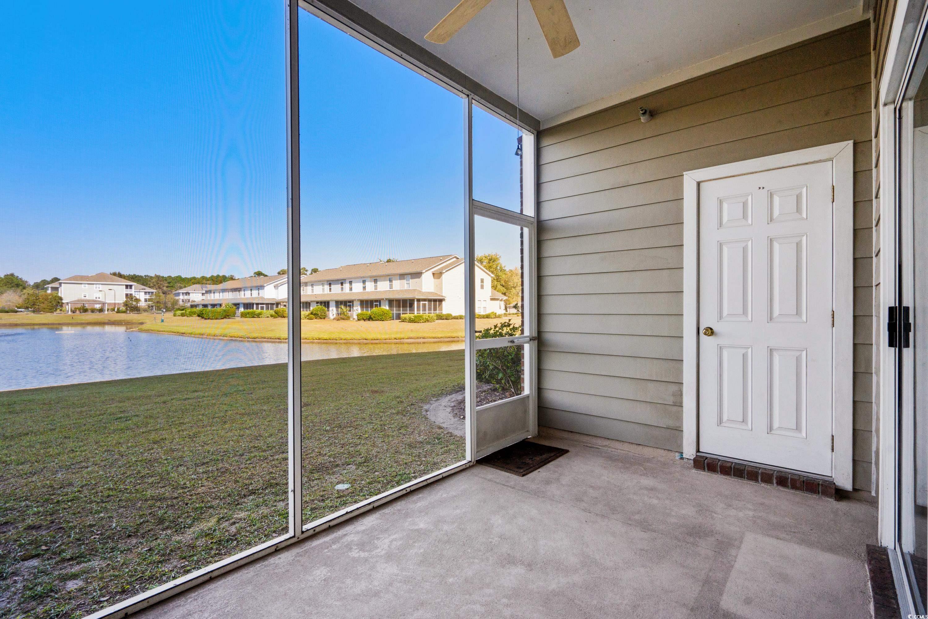 336 Kiskadee Loop, Unit B Conway, SC 29526 - Photo 21 of 40 Unfurnished sunroom with a water view and ceiling fan