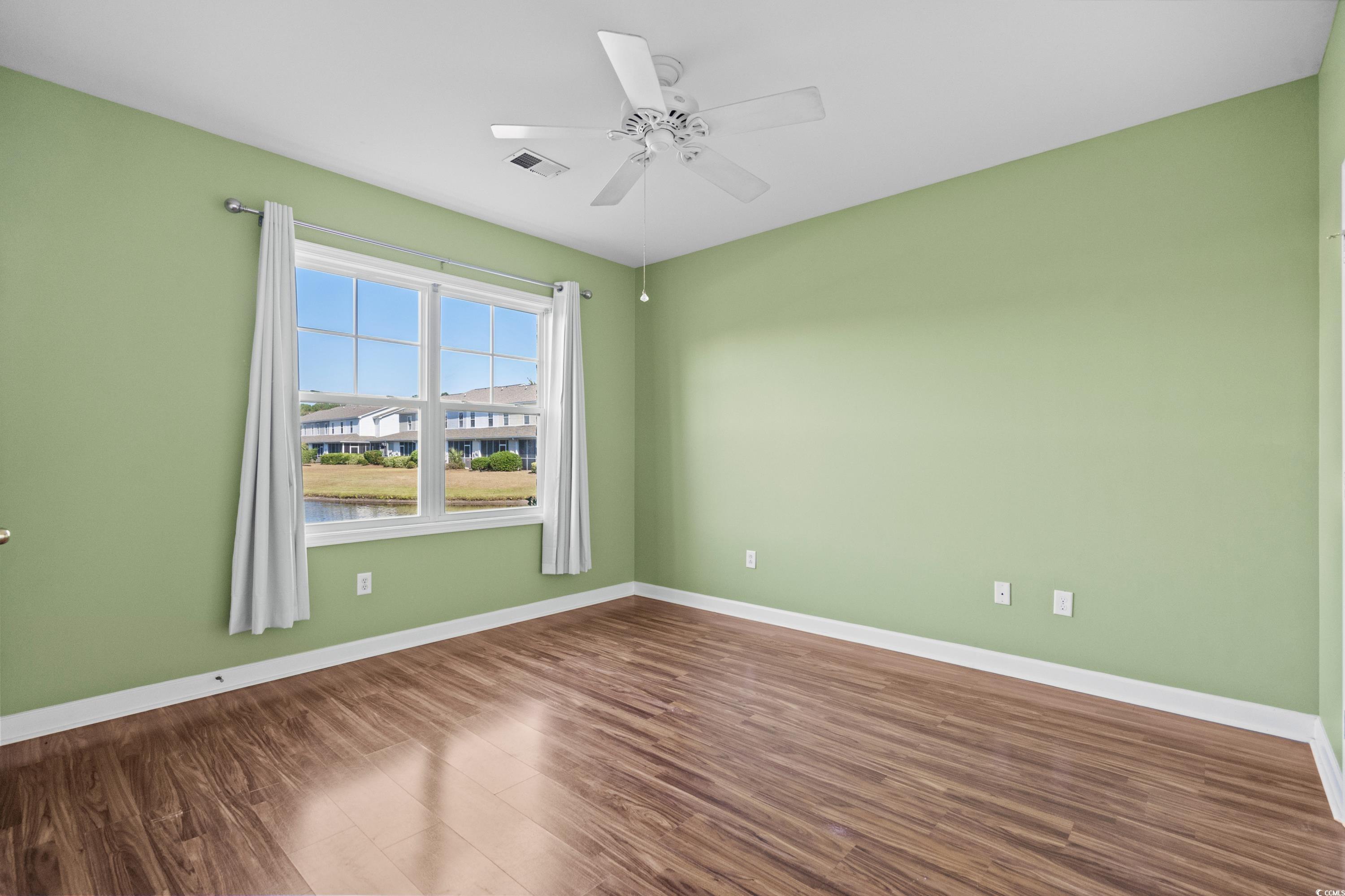 336 Kiskadee Loop, Unit B Conway, SC 29526 - Photo 22 of 40 Unfurnished room with hardwood / wood-style flooring and ceiling fan