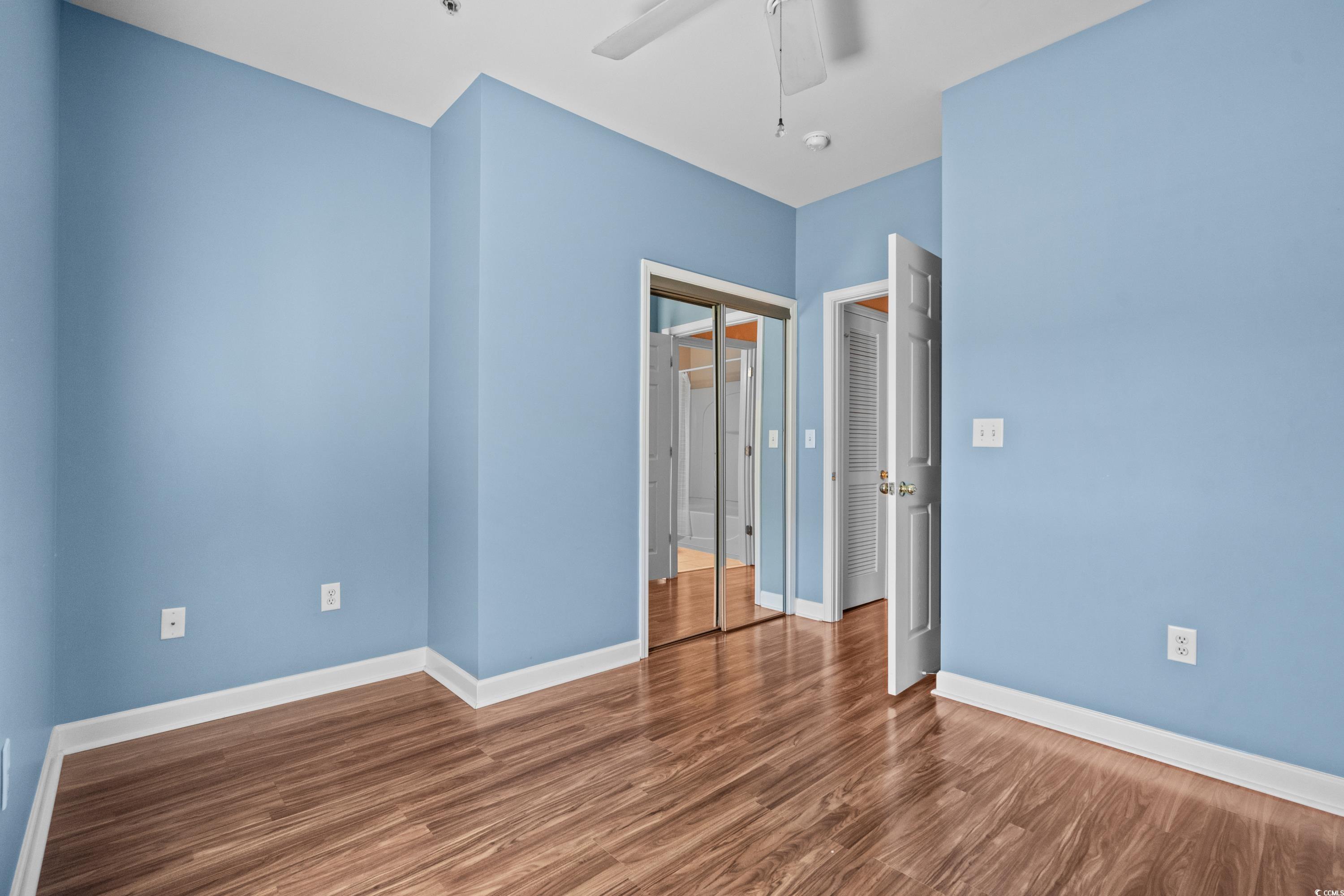 336 Kiskadee Loop, Unit B Conway, SC 29526 - Photo 28 of 40 Unfurnished room featuring ceiling fan and hardwood / wood-style flooring