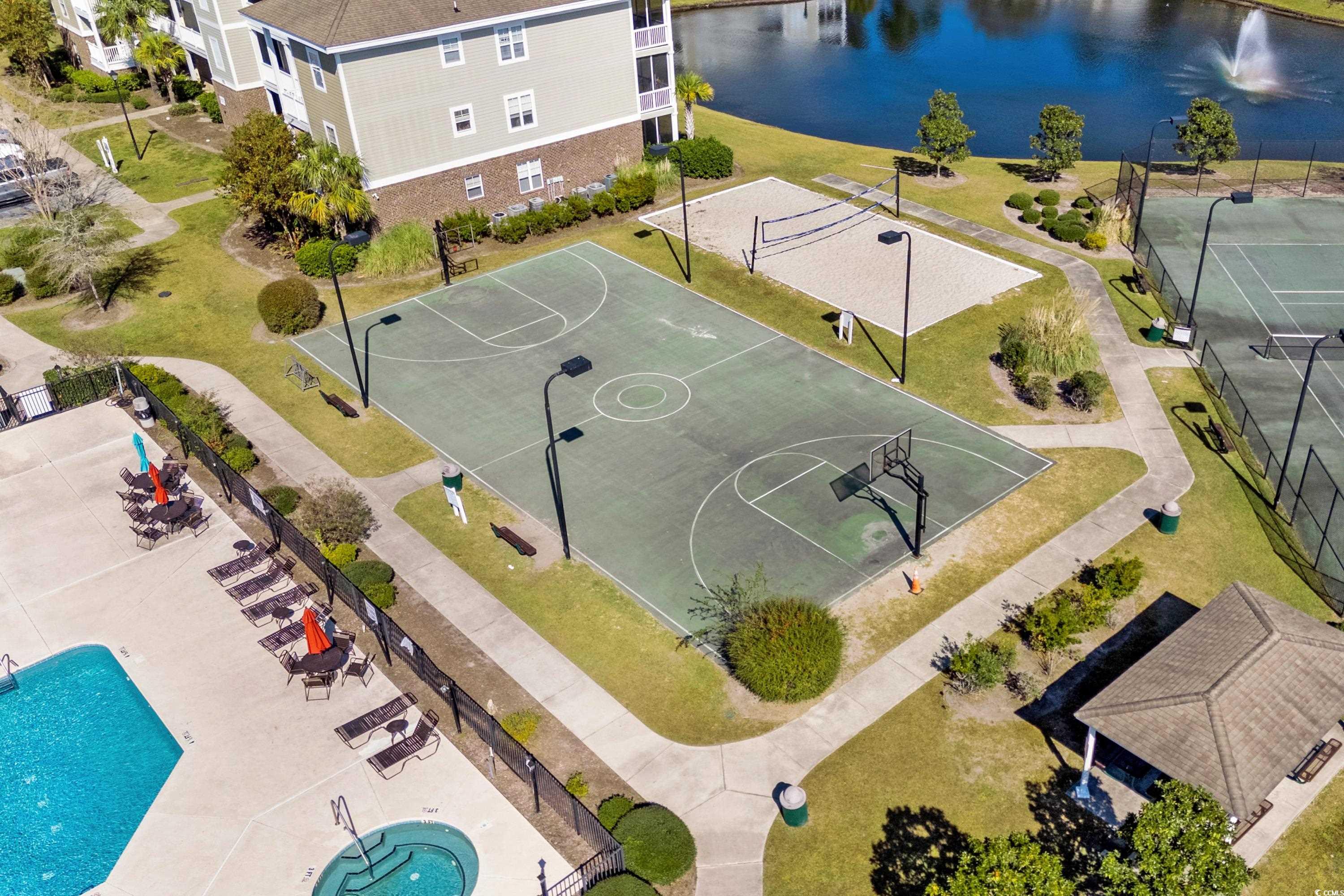 336 Kiskadee Loop, Unit B Conway, SC 29526 - Photo 36 of 40 View of sport court featuring a water view and a community pool