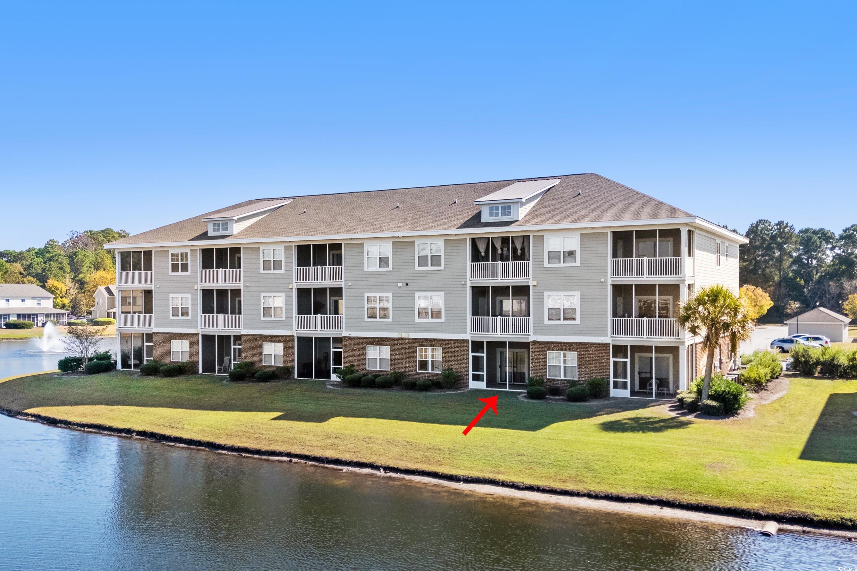 336 Kiskadee Loop, Unit B Conway, SC 29526 - Photo 4 of 40 View of building exterior with a water view