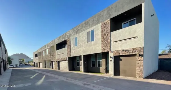 a view of a building with a street