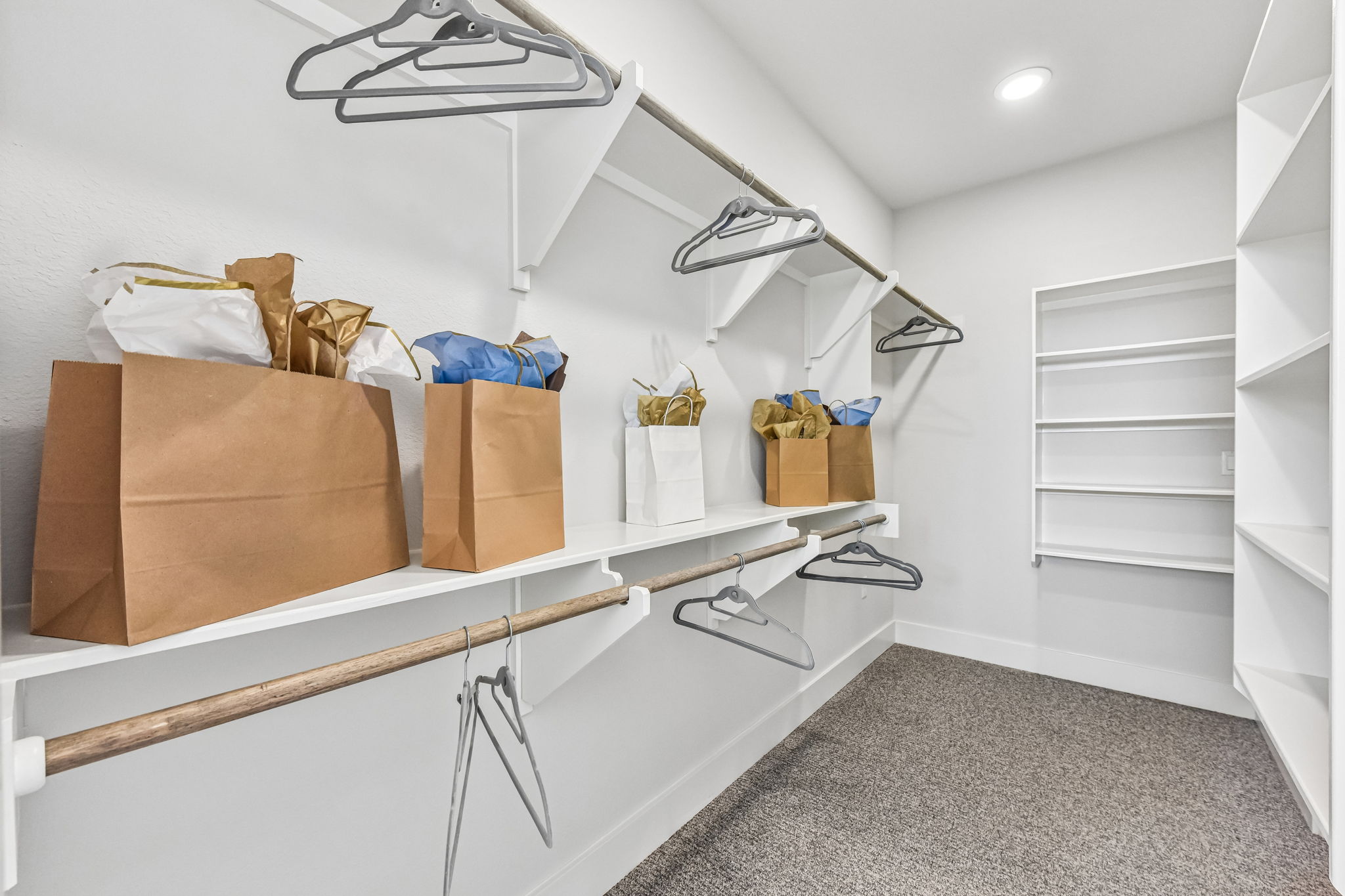 9033 Cattle Baron Path Austin, TX 78747 - Photo 31 of 40 Ample shelving and hanging space defines this functional, well-lit walk-in closet.