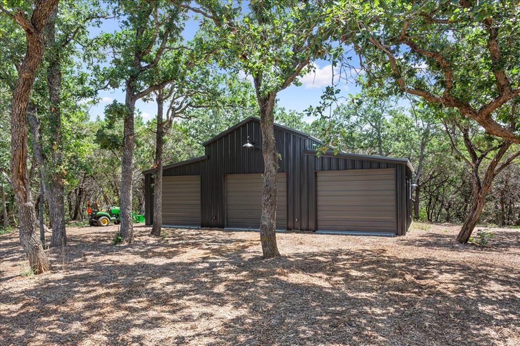 15988 Wortham Bend Road China Spring, TX 76633 - Photo 36 of 40 24'x 40' red-iron workshop, fully insulated with 3 10'x8' doors
