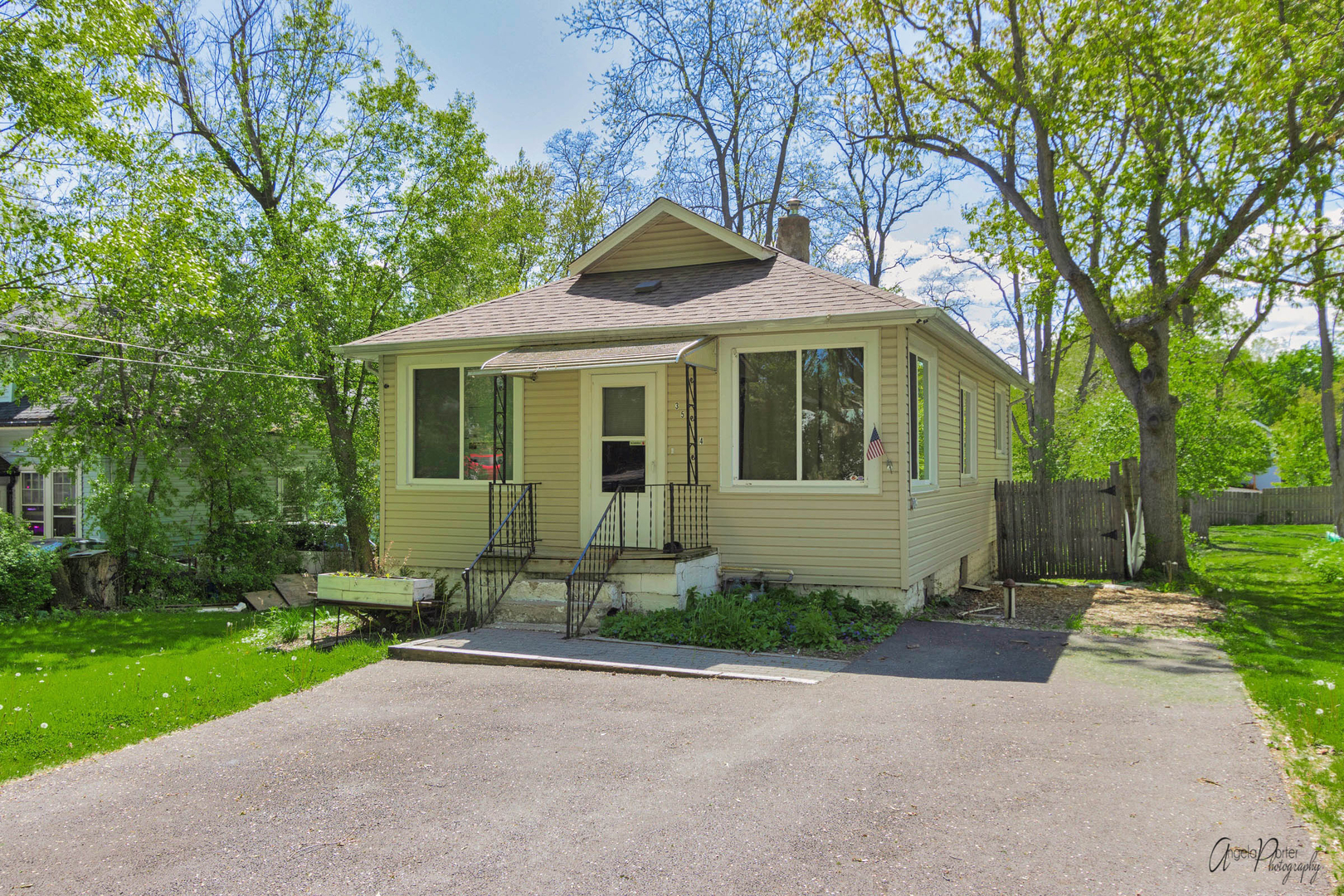 35674 North Wilson Road Ingleside, IL 60041 - Photo 1 of 18 a front view of a house with a yard and trees