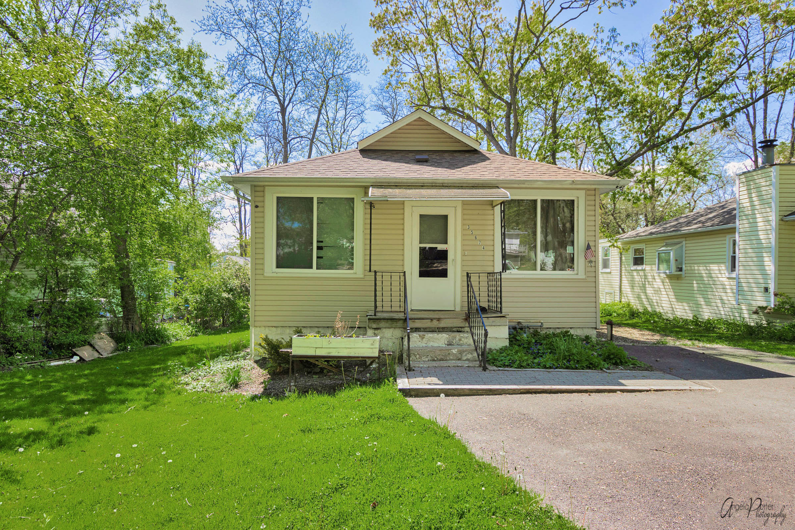 35674 North Wilson Road Ingleside, IL 60041 - Photo 3 of 18 a front view of a house with a yard