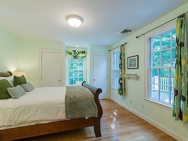 4 Cedar Street Natick, MA 01760 - Photo 16 of 21 a bedroom with a large bed and a window