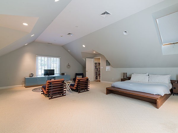 4 Cedar Street Natick, MA 01760 - Photo 18 of 21 a spacious bedroom with a bed and a couch