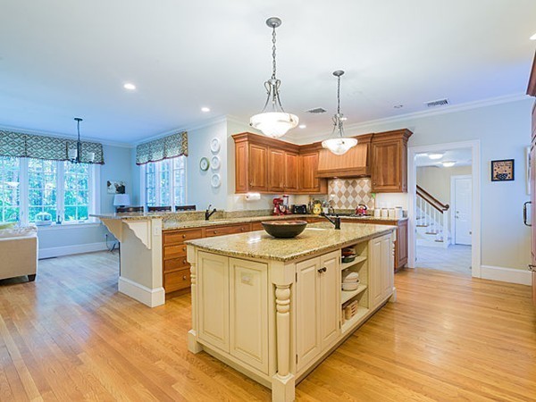 4 Cedar Street Natick, MA 01760 - Photo 4 of 21 a kitchen with stainless steel appliances granite countertop a stove and a large window