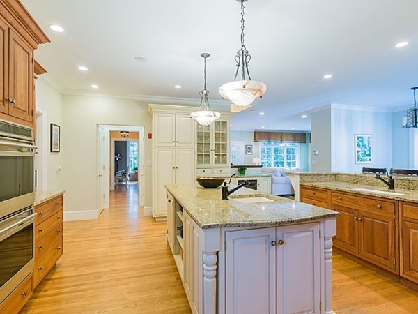 4 Cedar Street Natick, MA 01760 - Photo 5 of 21 a kitchen with stainless steel appliances granite countertop a sink a stove and a wooden floors
