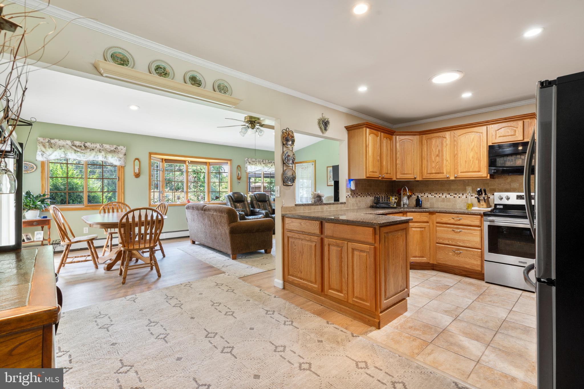 27 Jasmine Road Levittown, PA 19056 - Photo 7 of 33 Inviting open kitchen with warm wood accents.