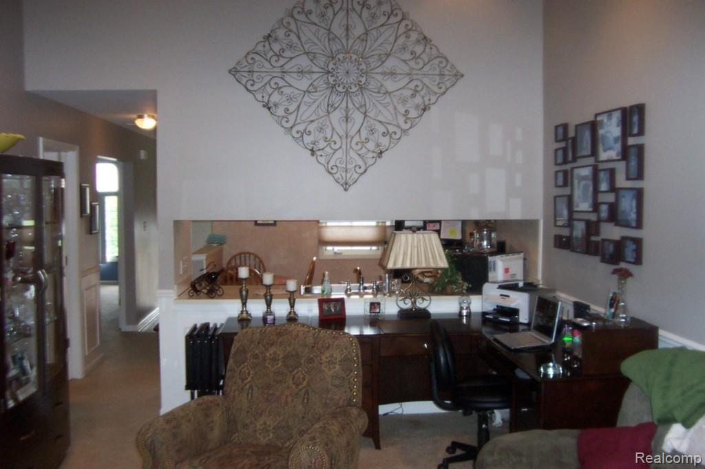 900 Ridge Court, Unit 121 Brighton, MI 48116 - Photo 8 of 19 living room towards kitchen