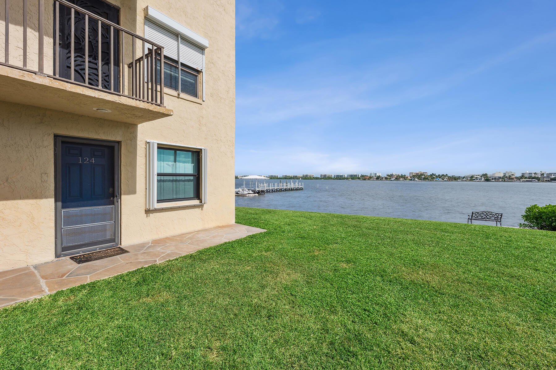 a view of a house with a yard and sitting area