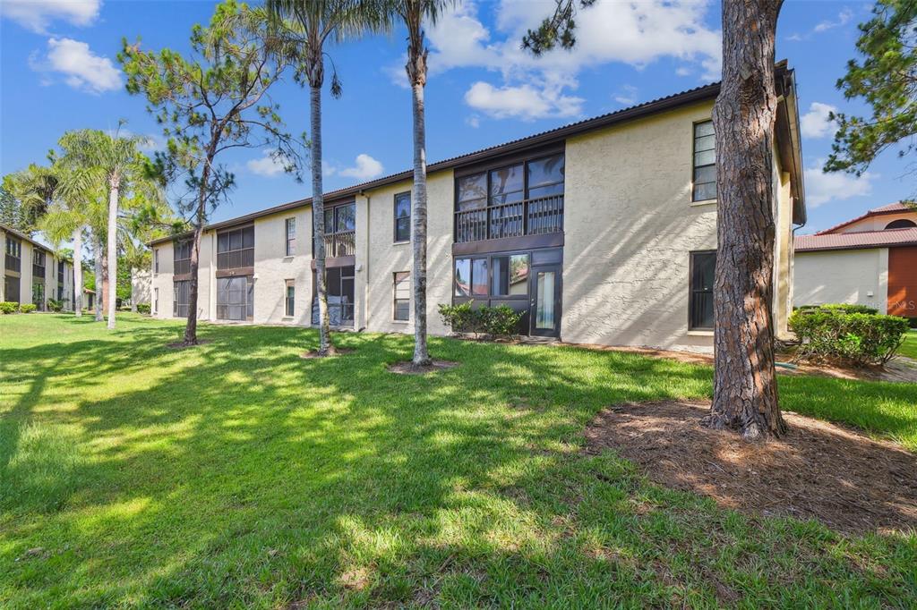 1801 East Lake Road South, Unit 3A Palm Harbor, FL 34685 - Photo 31 of 56 a house view with a garden space