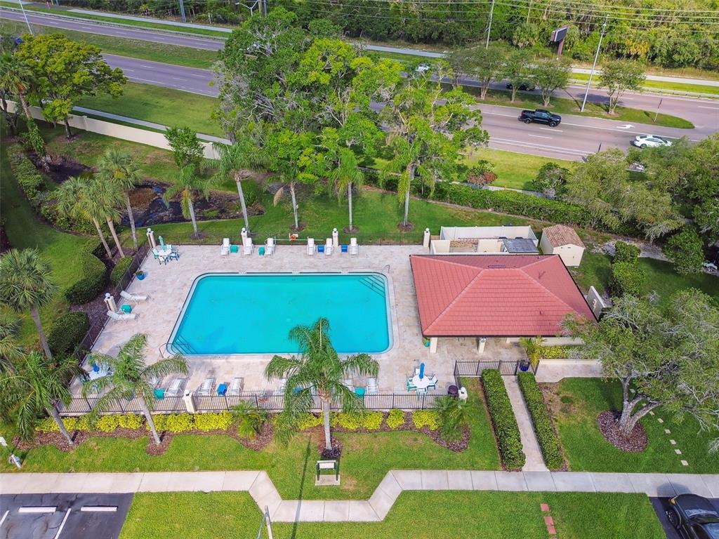 1801 East Lake Road South, Unit 3A Palm Harbor, FL 34685 - Photo 51 of 56 an aerial view of a house with garden space and street view
