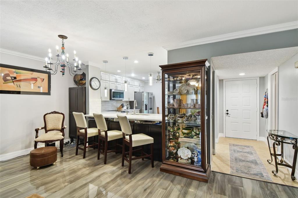 1801 East Lake Road South, Unit 3A Palm Harbor, FL 34685 - Photo 9 of 56 a very nice looking dining room with a table and chairs